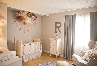 Rylee's peach and gray nursery has many playful, vintage items and custom made decorations.