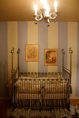 Beatrix Potter Nursery Bedding and Decor.  I love the way the baby's crib looks with the blue and white striped walls and the artwork. 