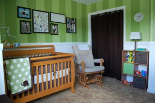 Green and brown elephant nursery with striped walls