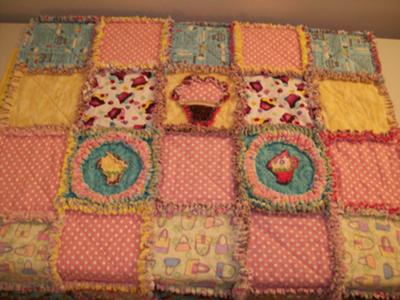 A colorful baby girl's cupcake theme rag quilt would make a lovely personalized baby shower or birthday gift!  
