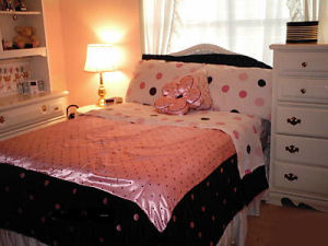 teen girls bedroom in pink and black polka dots bedding