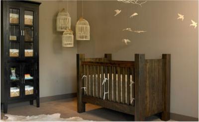 Rustic log cabin style baby nursery room with homemade wooden crib 