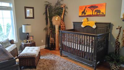 The baby's crib in our jungle baby nursery theme