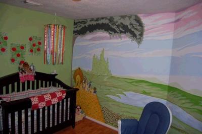 The Wizard of OZ nursery mural, the mobile, the poppy canvases, and her crib