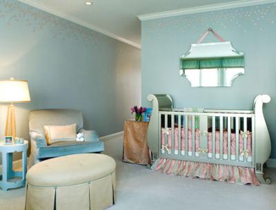 Elegant blush pink and blue baby nursery with metallic silver crib.