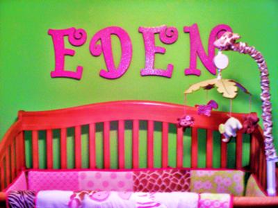 The hot pink, glitter wall letters spell my baby girl's name and provide the ultimate 