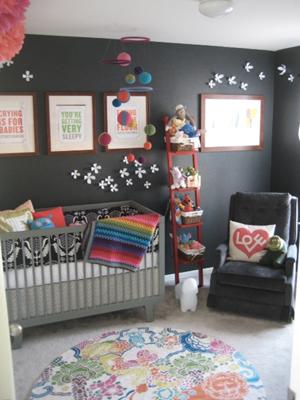 Colorful Baby Girl Nursery w Charcoal Gray Wall - The gray wall color serves as a background that makes the colorful decorations in the room like the homemade baby mobile really POP! 