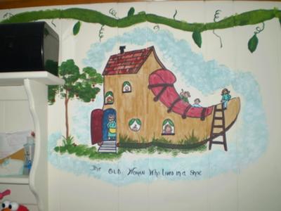 Painting all of the children inside and on top of the shoe in The Old Woman Who Lived In A Shoe segment of the baby's Mother Goose nursery rhymes wall mural required much attention to detail but it turned out beautifully.