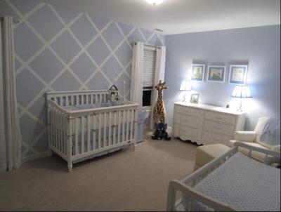 Baby blue and white nursery with a lattice pattern painted on the wall via a DIY painting technique 