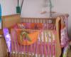 The crib with its pink and orange surf theme baby bedding set that we chose our baby girl's surfer nursery 