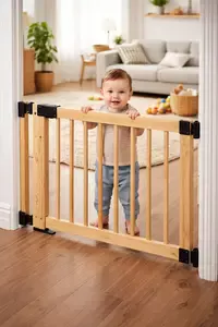 Baby gate installed at a doorway in a home with young children