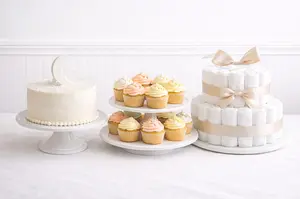 Elegant baby shower cake ideas with a styled dessert table in soft pastel colors