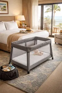 Best travel crib set up in a clean hotel room for a family vacation with a lightweight foldable design