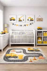 Modern construction themed nursery with dump truck wall art and road pattern rug