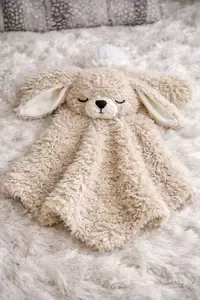 Handmade crochet bunny lovey with fuzzy faux fur yarn and soft floppy ears, a baby comfort blanket lovie