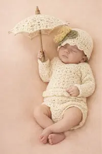 Matching crochet umbrella, diaper cover and beany hat set for a baby girl