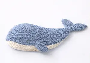 Free crochet whale pattern made as a soft baby lovey snuggler in an ocean nursery style