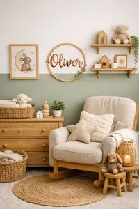DIY baby nursery ideas on a budget featuring painted accent wall, wall art, and simple decor details