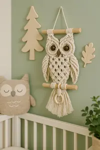 DIY macramé owl wall hanging in soft sage and cream woodland nursery decor