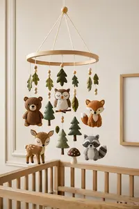 DIY woodland crib mobile with felt forest animals and neutral nursery colors