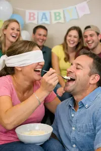 Guests laughing while playing a blindfold baby shower game