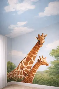 Nursery wall mural with a giraffe scene and clouds extending toward the ceiling