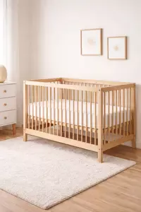 modern low VOC baby crib in a clean nursery room with natural wood finish and minimal decor
