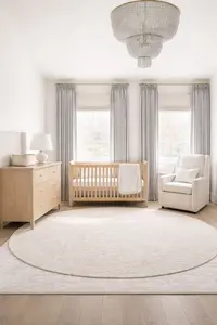 nursery layout ideas for square rooms showing crib dresser and chair arranged in a balanced square nursery