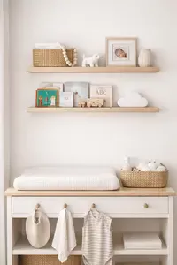 floating nursery wall shelves with baby books and decor in a neutral baby room