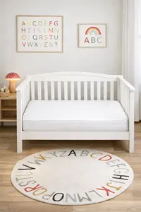Standard crib mattress fitting snugly inside a full-size baby crib with no gaps in an ABC alphabet baby nursery theme room 