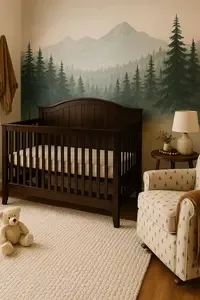 Cozy woodland baby nursery with a dark walnut crib and mountain mural