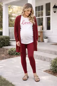Casual Jewel tone ruby red Valentines Day maternity photoshoot outfit with leggings, long cardigan, and statement tee