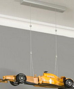 vintage model race car hung from a baby boy nursery ceiling