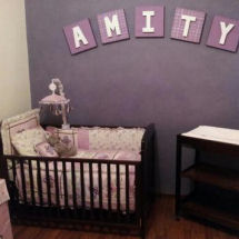 Baby girl purple nursery with purple and ivory wall paint color lavender crib bedding and large wooden wall letters