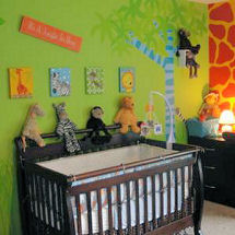 Lime green walls in a baby jungle nursery theme with walls stenciled with zebra stripes and animal prints in wild colors