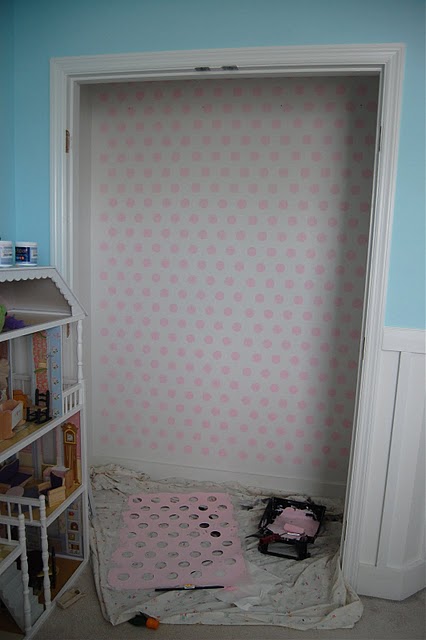 The plain, white closet walls before Tiffany gave them their painted polka dot makeover.