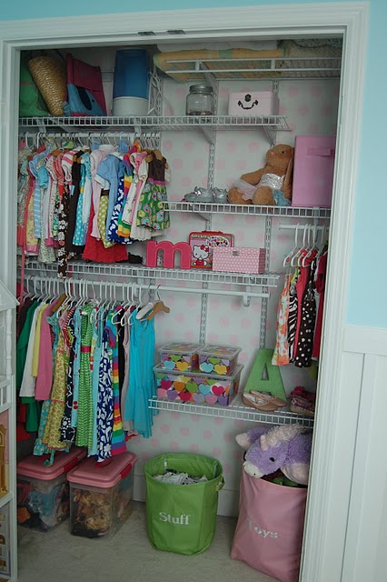 The girls' closet painted in pretty pink polka dots.