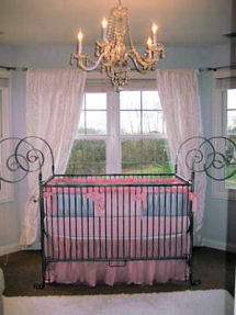 Elegant modern pink blue and white baby girl princess nursery with crystal chandelier