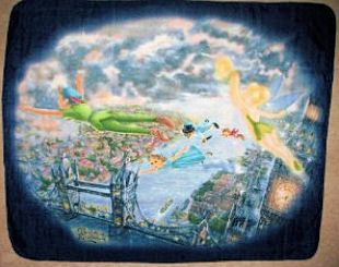 Peter Pan and Tinkerbell fleece blanket that is draped on the rocking chair in the baby's nursery