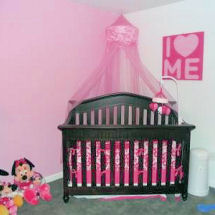 Hot pink and white princess nursery with a pink gauze princess crown canopy and damask print crib set