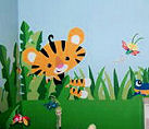 Cute jungle theme baby nursery room with animals monkeys and butterflies