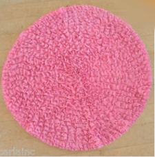 Fluffy, round pink rug for a baby girl nursery room or teen girl bedroom.