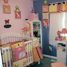 Pink purple yellow and blue tropical jungle nursery theme for a baby girl with zebra crib bedding in pastel colors