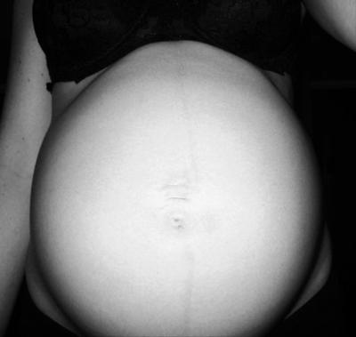 Pregnant tummy picture taken at 36 weeks pregnant..as you can see my stomach is very round