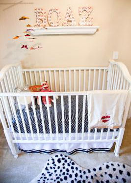 A baby boy nursery decorated in black and white cheetah print