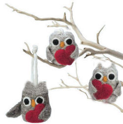 Homemade tree branch mobile with felted owl ornaments