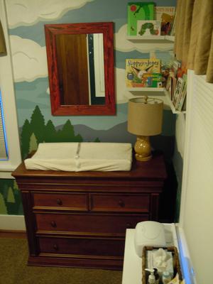 The changing area of the baby's nature themed nursery room