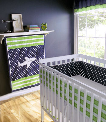 Green black and white airplane baby crib bedding set with polka dots for an aviator nursery theme