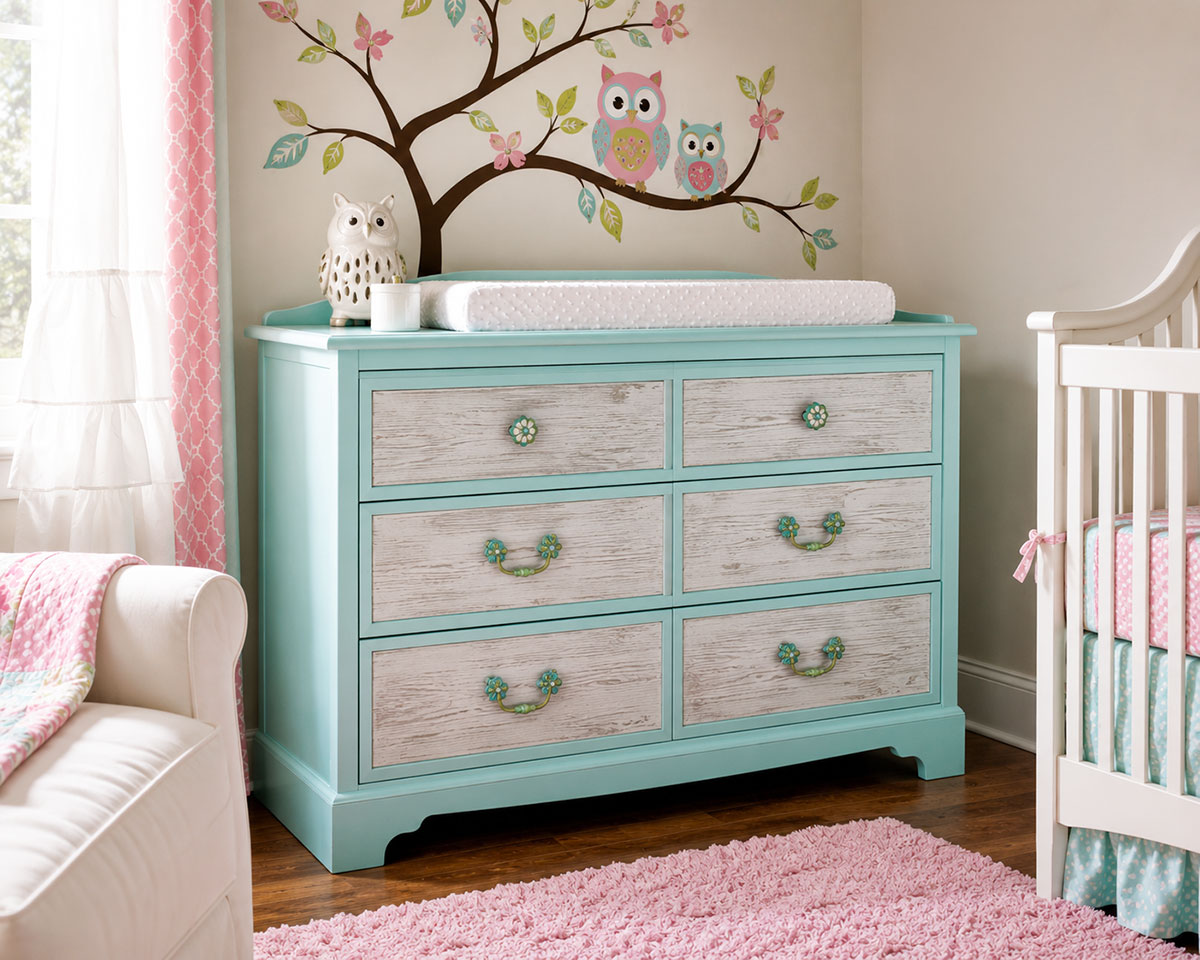 Budget nursery dresser and changing table painted aqua with faux bois drawer fronts and updated hardware