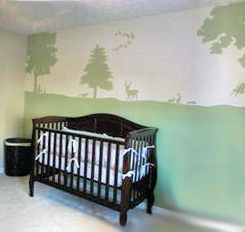 A baby nursery wall mural depicting forest creatures deer and geese flying south for the winter